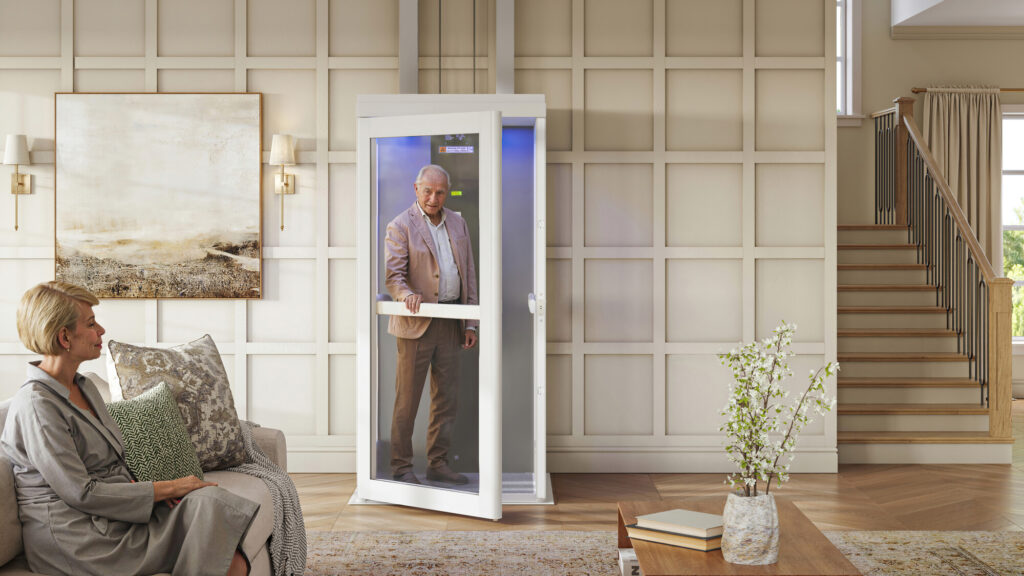 Homeowner standing comfortably inside a residential elevator
